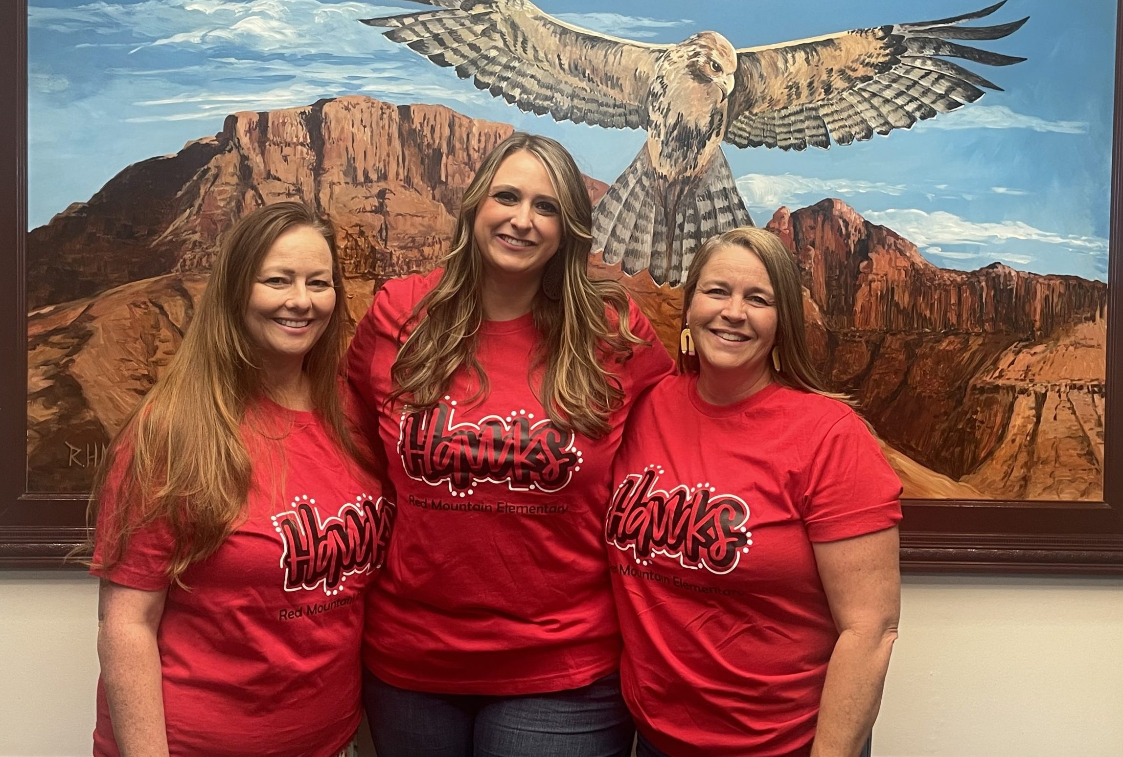 Three women standing together