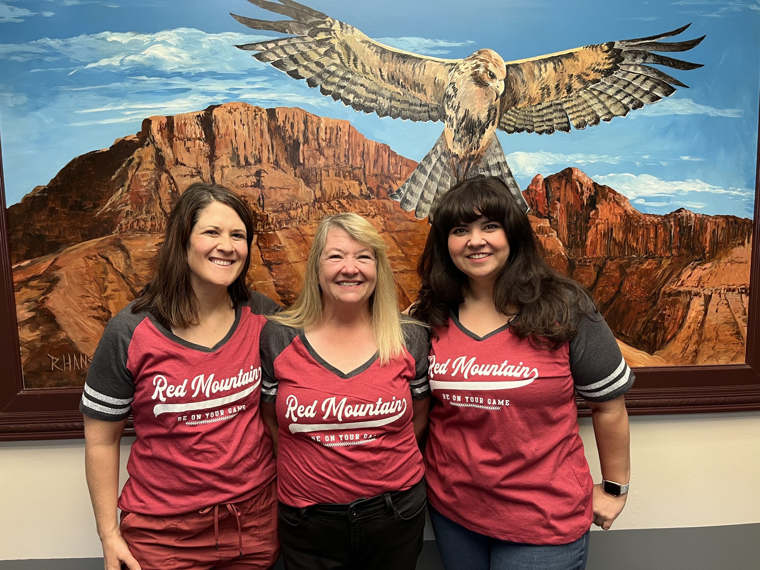 Three women standing together